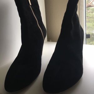 Michael Khor’s black ankle boots. Black suede.